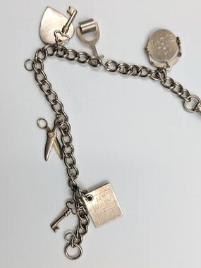 Silver Charm Bracelet with ILU Spinner, Scissors, Key & Heart Charms